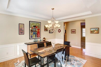 Dining Room with tray ceiling and picture frame pa