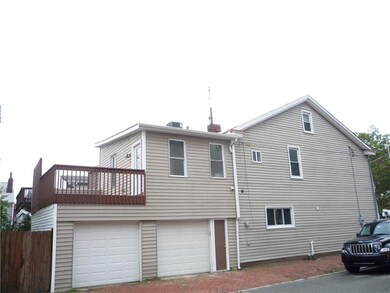 Two car attached garage open upper deck area