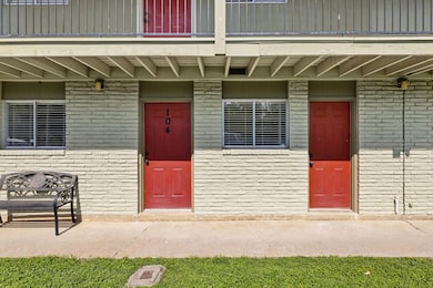 Entrance to property featuring brick siding and a