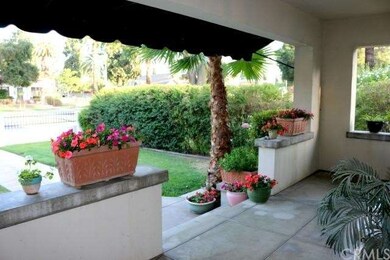 Lovely custom awning keeps the porch shaded and co