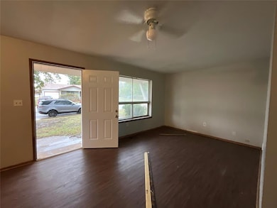 Spare room featuring dark wood-type flooring and c