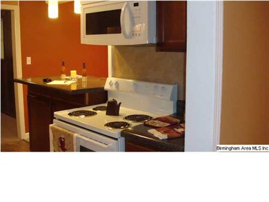 The kitchen has a new stove and built-in microwave