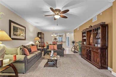 Living room featuring light colored carpet, orname