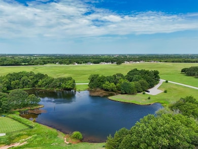 Aerial view of a nearby body of water and a local golf course