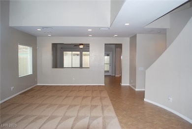 Living room/dining room area with vaulted ceiling