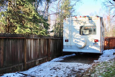 Parking pad behind fence fits a 26ft RV