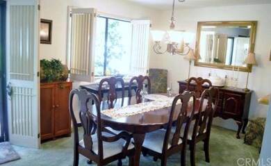 Dining Room with plantation shutters and sliding d