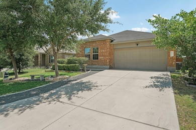 View of front of house with concrete driveway, an