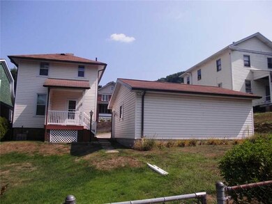 Exterior Back. The back yard has some slope, but w