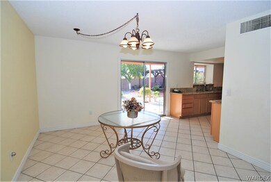 dining room with partial view of kitchen and slidi