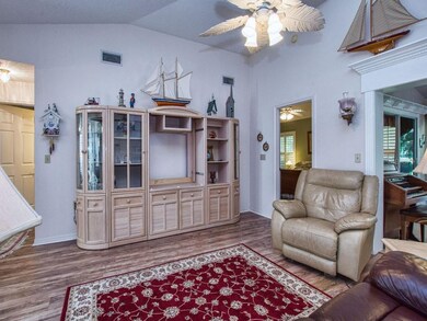 Family room with entry to owner's suite and enclos