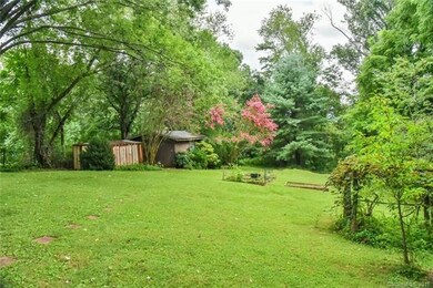 Another view of large rear yard, detached sheds