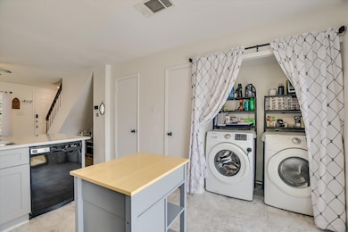 Washer, dryer and mobile island are included with the home!