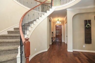 curved staircase and entry