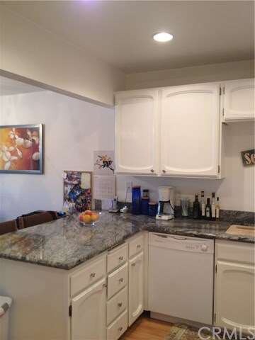 Kitchen opens to living room and dining room