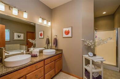 Updated double vanity and walk-in shower in master