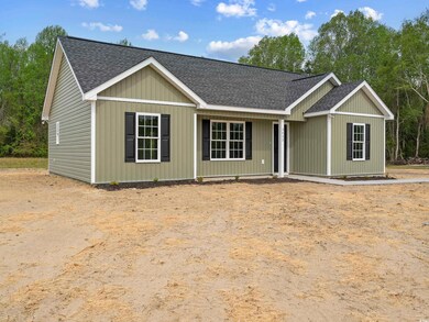 Ranch-style home featuring a shingled roof