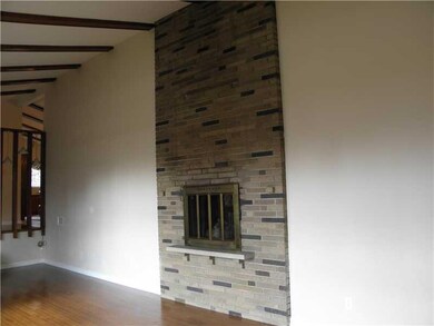 Living Room. Floor to Ceiling Fireplace