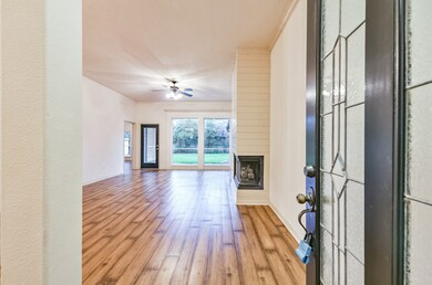 Step into this charming home and feel the warmth. Enter from the covered front porch through the wood & leaded glass door and notice the floor to ceiling windows overlooking the backyard patio.