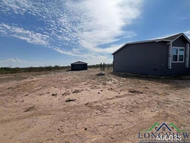 View of yard with an outbuilding