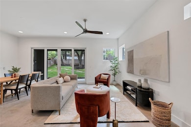 Living area featuring recessed lighting and ceiling fan