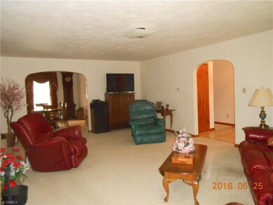 Huge living room flowing into dining room and entr
