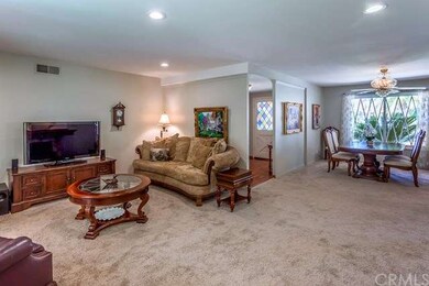 The living room is open to the formal dining room.