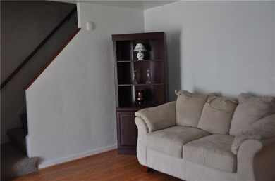 Alternate view of the living room leading to upsta