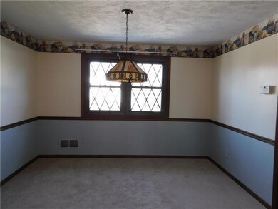 Spacious Dining Room with double windows and chair