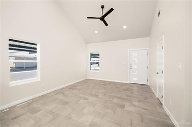 Spare room featuring high vaulted ceiling, recessed lighting, and ceiling fan