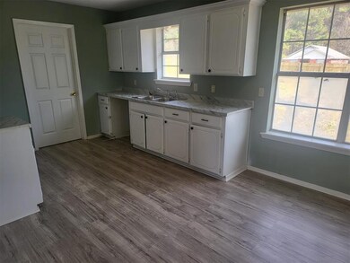 Kitchen featuring plenty of natural light, white c
