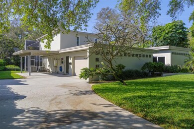 Side of home with garage and carport
