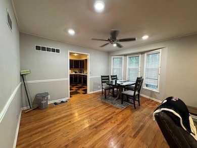 Dining area featuring wood finished floors, a ceiling fan, and recessed lighting