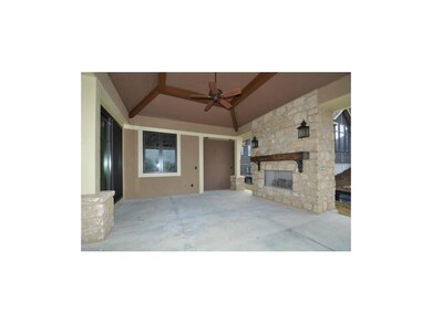 Veranda with wood ceiling, fireplace, inset for gr