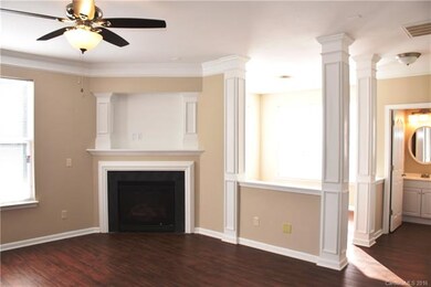 Great room features a new ceiling fan, gas log fir