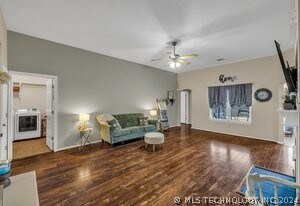 Spacious living room with wood veneer flooring.