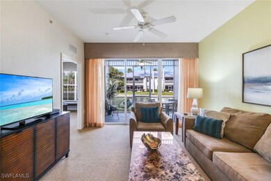 Living room with light carpet and ceiling fan
