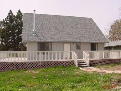 Front of home with large deck.