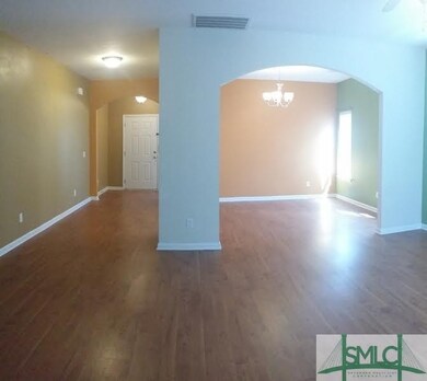 Living room with View of Entry and Formal Dining R