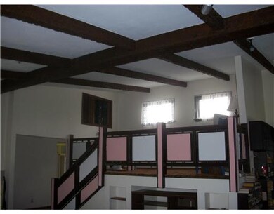 Den. Elevated area- balcony over great room.