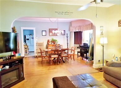 Arched entry into the dining area with large bay w