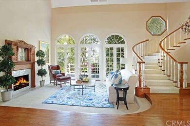 Two-story living room with hardwood floors and fir