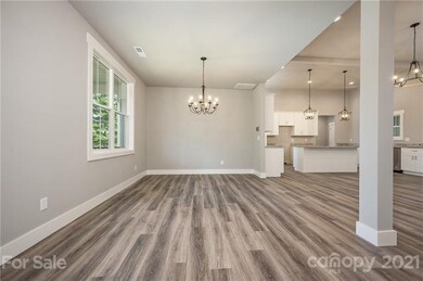 Dining room then kitchen beyond