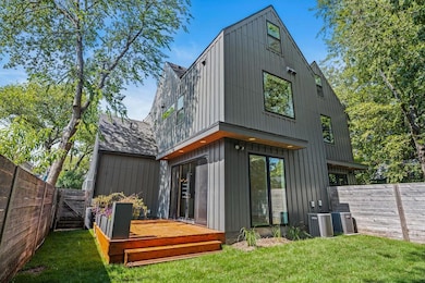 Back of property featuring a fenced backyard, a w