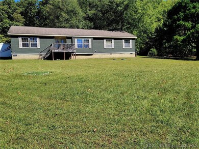 One level living on 11+- acres!