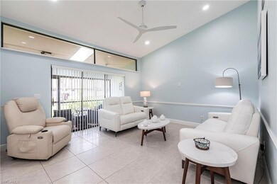 Living area featuring light tile patterned floors, ceiling fan, recessed lighting, baseboards, and high vaulted ceiling