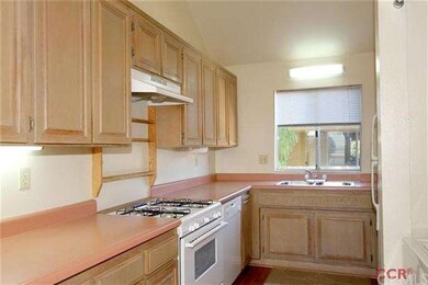 Kitchen with plenty of storage, gas range and dish