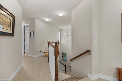 Stairway featuring tile patterned floors and a cha