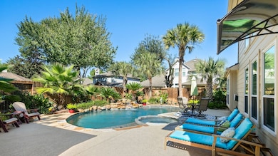 This charming two-story brick home features a well-maintained front yard with mature trees and landscaping. It has a double garage and a welcoming entrance, perfect for families seeking a comfortable and inviting residence.