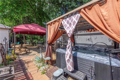 View of terrace with a gazebo and hot tub